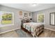 Serene bedroom featuring two large windows and plush area rug at 3260 Osceola Rd, St Cloud, FL 34772