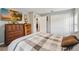 Comfortable bedroom with a gray, white, and brown color scheme and a large flat screen TV at 3260 Osceola Rd, St Cloud, FL 34772