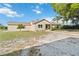 Charming single-story home with neutral paint, a chimney, and well-kept front yard landscaping at 3260 Osceola Rd, St Cloud, FL 34772