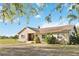 Inviting single-story home with a well-manicured lawn and mature landscaping, creating curb appeal at 3260 Osceola Rd, St Cloud, FL 34772