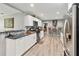 Open kitchen with stainless steel appliances, breakfast bar, and gray backsplash at 3260 Osceola Rd, St Cloud, FL 34772