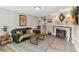 Comfortable living room featuring a fireplace, stylish furnishings, and an open layout at 3260 Osceola Rd, St Cloud, FL 34772