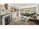 Spacious living room featuring a cozy fireplace, comfortable seating, and ample natural light at 3260 Osceola Rd, St Cloud, FL 34772