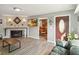 Cozy living room with a fireplace, modern decor, and an inviting atmosphere at 3260 Osceola Rd, St Cloud, FL 34772