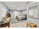 Well-lit main bedroom with wood bed frame, plush rug, barn door and recessed lighting at 3260 Osceola Rd, St Cloud, FL 34772