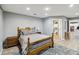 Comfortable main bedroom featuring queen bed, soft rug, and en suite bathroom at 3260 Osceola Rd, St Cloud, FL 34772