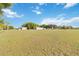 Wide shot of the property features a home and a barn, offering ample space and greenery on a sunny day at 3260 Osceola Rd, St Cloud, FL 34772