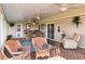 A relaxing and bright sunroom offers a versatile space for dining and a comfortable seating area at 3260 Osceola Rd, St Cloud, FL 34772