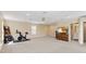 Large bonus room provides versatile space for recreation, home gym, and features adjacent bathroom at 3317 Schoolhouse Rd, Harmony, FL 34773