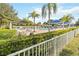 Beautiful community pool area features ample seating, shade, lush landscaping and resort-style amenities at 3317 Schoolhouse Rd, Harmony, FL 34773