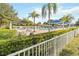 Inviting community pool area with ample seating, shade structures, and well-maintained landscaping at 3317 Schoolhouse Rd, Harmony, FL 34773