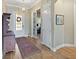Elegant foyer featuring hardwood floors, classic decor, and inviting natural light at 3317 Schoolhouse Rd, Harmony, FL 34773