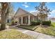 Charming single-story home featuring a welcoming front porch with stately columns and beautiful landscaping at 3317 Schoolhouse Rd, Harmony, FL 34773