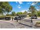 A row of white golf carts parked on brick pavers at the Harmony golf course at 3317 Schoolhouse Rd, Harmony, FL 34773
