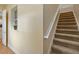 Hallway with views of stairs and a small window with natural light and a view to the outside at 3317 Schoolhouse Rd, Harmony, FL 34773