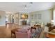 Inviting living room with wood floors, ceiling fan, and decorative wall art at 3317 Schoolhouse Rd, Harmony, FL 34773