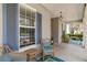 Comfortable porch seating area with stylish decor and a tranquil outdoor setting at 3317 Schoolhouse Rd, Harmony, FL 34773
