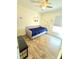 Charming bedroom with blue covers, Mickey Mouse wall decor, wood-look flooring and natural light at 334 Sonja Cir, Davenport, FL 33897