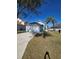 View of the single Gathering home featuring attached garage, driveway and grass lawn at 334 Sonja Cir, Davenport, FL 33897