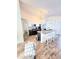 Kitchen featuring granite countertops, stainless steel appliances, island with bar seating and hardwood floors at 334 Sonja Cir, Davenport, FL 33897