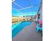 Enjoy this screened-in pool with clear blue water on a sunny day, perfect for relaxing and entertaining at 334 Sonja Cir, Davenport, FL 33897