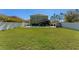 Spacious backyard with a pool, a patio, and a privacy fence at 3384 Cordgrass Pl, Harmony, FL 34773
