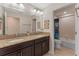 Bathroom features double vanity and granite counter, and walk-in shower at 3384 Cordgrass Pl, Harmony, FL 34773