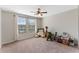Spacious bedroom with neutral walls, carpeted floors and a window that brings in natural light at 3384 Cordgrass Pl, Harmony, FL 34773