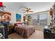 Comfortable bedroom with carpeted floors, ceiling fan and a window letting in natural light at 3384 Cordgrass Pl, Harmony, FL 34773