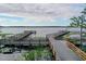 Beautiful Community Dock on a tranquil lake, providing access for boating and outdoor activities at 3384 Cordgrass Pl, Harmony, FL 34773