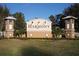Welcoming entrance sign for Harmony community, featuring decorative pillars and well-maintained landscaping at 3384 Cordgrass Pl, Harmony, FL 34773