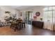 Dining area with sliding doors to the patio, an accent wall hanging, and a view of the backyard at 3384 Cordgrass Pl, Harmony, FL 34773