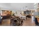 Open floor plan, kitchen leads into living and dining area with stone accent wall at 3384 Cordgrass Pl, Harmony, FL 34773
