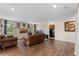 Spacious living room featuring hardwood floors and plenty of natural light at 3384 Cordgrass Pl, Harmony, FL 34773
