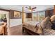 Spacious bedroom with hardwood floors and ample natural light from multiple windows at 3384 Cordgrass Pl, Harmony, FL 34773