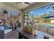 Covered patio with comfortable seating, a ceiling fan, and a view of the pool at 3384 Cordgrass Pl, Harmony, FL 34773