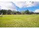 Expansive community soccer field surrounded by green grass and neighborhood homes, perfect for sports and recreation at 3384 Cordgrass Pl, Harmony, FL 34773