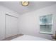 A clean and minimalistic bedroom featuring a double closet and bright window at 3818 Carrick Bend Dr, Kissimmee, FL 34746
