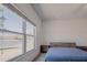 Bedroom featuring a waterfront view through a large window, providing natural light and a scenic backdrop at 3818 Carrick Bend Dr, Kissimmee, FL 34746