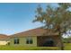 Exterior of home featuring a screened lanai that seamlessly connects the indoors with the outdoors at 3818 Carrick Bend Dr, Kissimmee, FL 34746