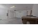 A clean and functional garage with a new garage door and a storage container at 3818 Carrick Bend Dr, Kissimmee, FL 34746