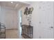 Bright hallway with tile floors, stylish decor, and a view to the front door at 3818 Carrick Bend Dr, Kissimmee, FL 34746