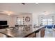 Kitchen and dining area with an island, granite countertops, stainless steel appliances, and a view of the lake at 3818 Carrick Bend Dr, Kissimmee, FL 34746