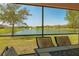 A comfortable outdoor lanai with views of the serene lake, perfect for relaxation at 3818 Carrick Bend Dr, Kissimmee, FL 34746