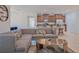 Open-concept living room with modern furniture, seamlessly connected to the kitchen and dining area at 3818 Carrick Bend Dr, Kissimmee, FL 34746