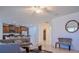 Open-concept living area featuring a modern kitchen, comfortable seating, and bright lighting with a seamless flow at 3818 Carrick Bend Dr, Kissimmee, FL 34746