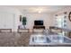 Open floor plan featuring a kitchen island with seating and a seamlessly connected living room for easy living at 3818 Carrick Bend Dr, Kissimmee, FL 34746