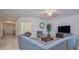 Spacious living room with neutral-toned furniture, tile flooring, and ample natural light at 3818 Carrick Bend Dr, Kissimmee, FL 34746