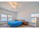 Bright bedroom with a modern bed, lake views, and abundant natural light, offering a serene and comfortable retreat at 3818 Carrick Bend Dr, Kissimmee, FL 34746