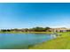 Beautiful lake view with a well manicured lawn leading up to the water and private boat docks at 3818 Carrick Bend Dr, Kissimmee, FL 34746